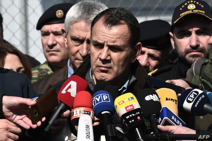 Greek Minister of defence Nikos Panagiotopoulos speaks to journalists in Kastanies on March 1, 2020. - Thousands more migrants…