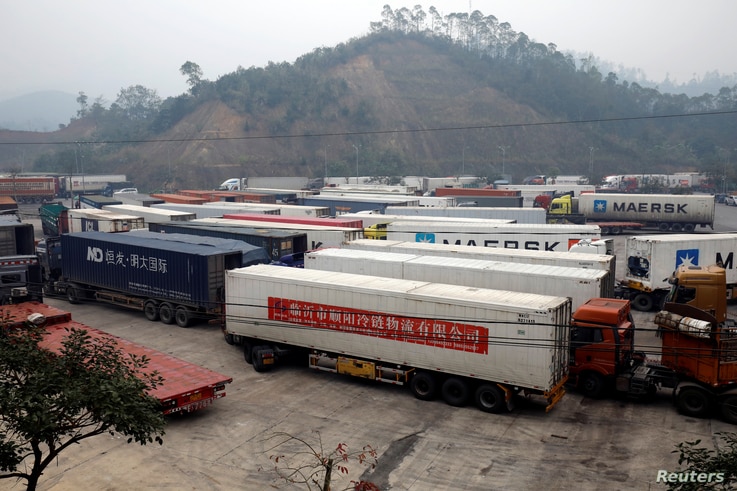 Container trucks are seen while waiting for cross the border at Huu Nghi border gate connecting with China, in Lang Son…