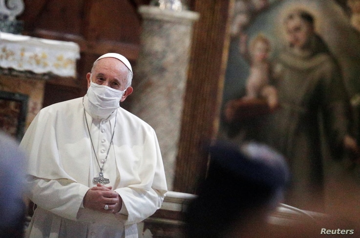 Pope Francis wearing a face mask attends an inter-religious prayer service for peace along with other religious representatives…