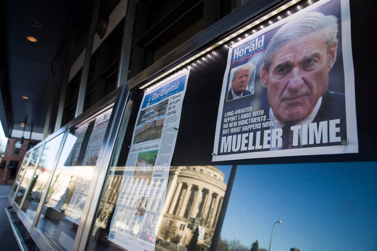 Newspaper front pages from around the nation are on display at the Newseum, March 23, 2019, in Washington. Special counsel Robert Mueller closed his Russia investigation with no new charges, ending the probe that has cast a shadow over Donald Trump's