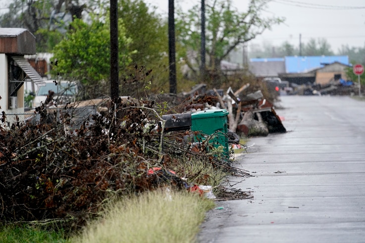 Debris sits near a street after Hurricane Laura hit nearly a month ago ahead of Hurricane Delta, in Lake Charles, Louisiana, Oct. 9, 2020. 