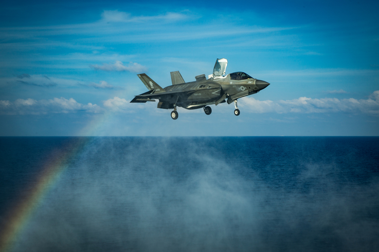 A U.S. Marines F-35B Lightning II fighter aircraft prepares to land on the flight deck in the South China Sea