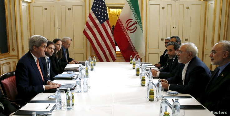 U.S. Secretary of State John Kerry (L) meets with Iranian Foreign Minister Mohammad Javad Zarif on what is expected to be …