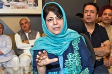 FILE - Former Jammu and Kashmir Chief Minister Mehbooba Mufti gestures as she addresses a news conference in Srinagar, June 19, 2018.