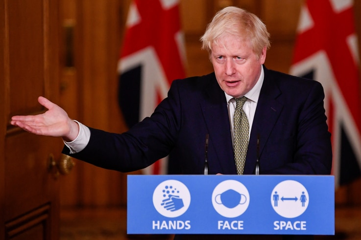 Britain's Prime Minister Boris Johnson gestures as he speaks during a virtual news conference on the ongoing situation with the coronavirus disease (COVID-19), at Downing Street, London, Oct. 12, 2020. 