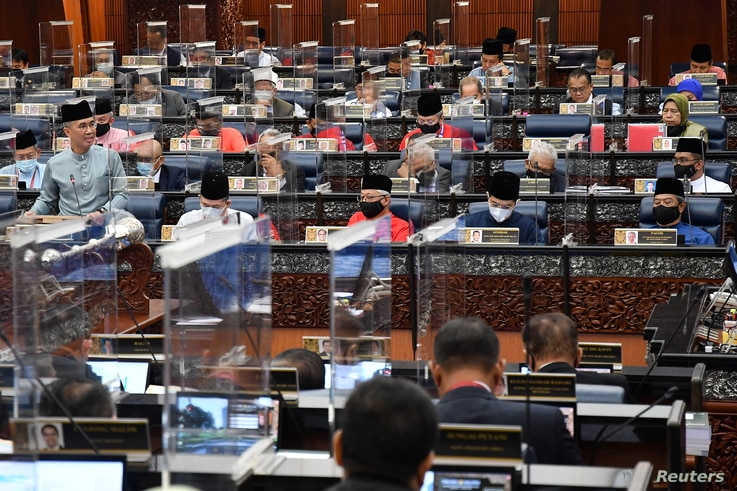 Malaysia's Finance Minister Tengku Zafrul presents the 2021 budget at the parliament house in Kuala Lumpur, Malaysia November 6…