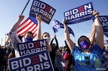 Supporters of Democratic U.S. presidential nominee Joe Biden celebrate near the site of his planned victory celebration.