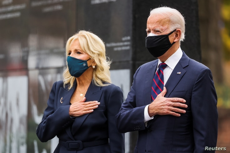 U.S. President-elect Joe Biden, accompanied by his wife Jill, attends a Veterans Day observance in Philadelphia, Pennsylvania, U.S., Nov. 11, 2020. 
