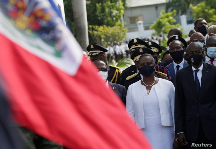 Haiti's President Jovenel Moise (R) and First Lady Martine Moise attend celebrations in Port-au-Prince, Haiti.