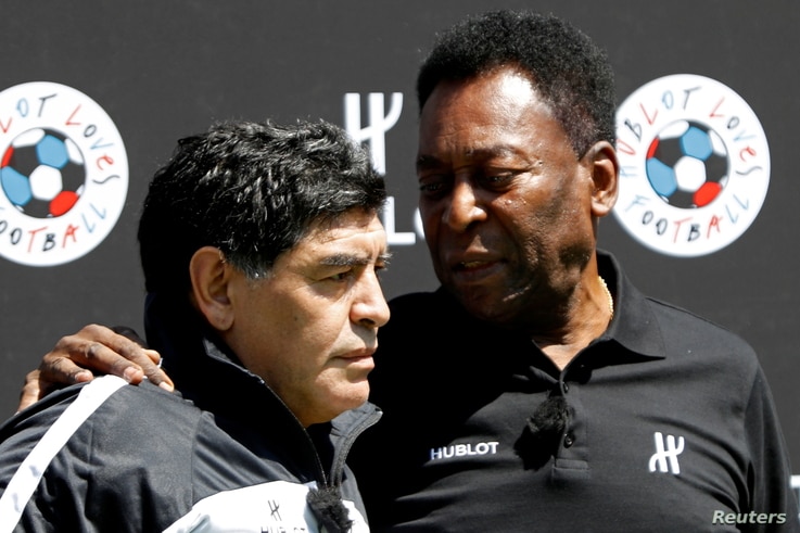 FILE PHOTO: Football legends Pele (R) and Diego Maradona attend an advertising soccer event on the eve of the opening of the…