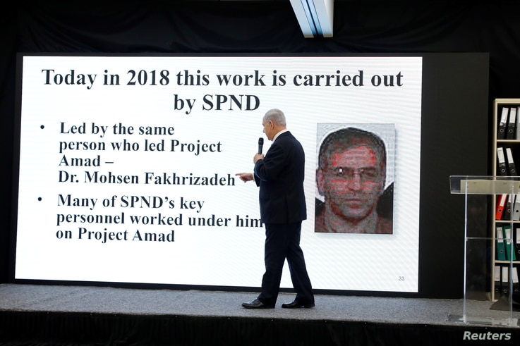 Israeli Prime Minister Benjamin Netanyahu points at a screen with an image of Iranian nuclear scientist Mohsen Fakhrizadeh during a news conference at the Ministry of Defence in Tel Aviv, April 30, 2018.