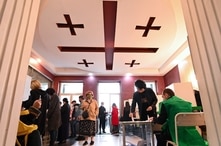 People visit a polling station to vote in Georgia's parliamentary election in Tbilisi on October 31, 2020, amid the ongoing…