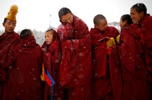 Tibetan monks attend a ceremony at the Langmu Lamasery during the 