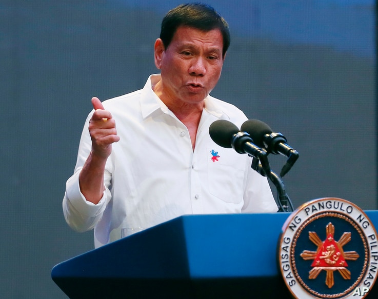 Philippine President Rodrigo Duterte gestures during his address to a Filipino business sector in suburban Pasay city south of Manila, Philippines, Oct. 13, 2016. 