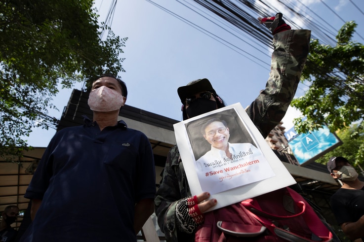 Activists gather for a rally with a photo of Thai dissident Wanchalearm Satsaksit in front of Cambodian Embassy in Bangkok,…