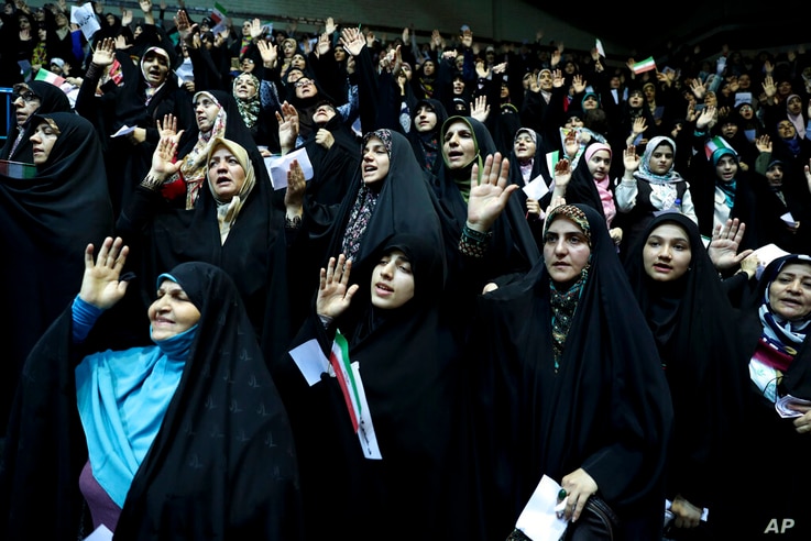 In this Thursday, July 11, 2019 photo, veiled Iranian women attend a ceremony in support of the observance of the Islamic dress…