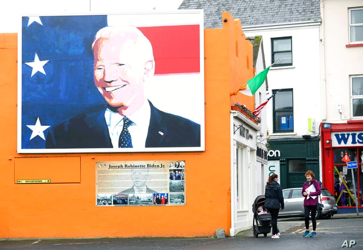 A mural of US Presidential candidate Joe Biden on a gable wall in Ballina, west of Ireland, Wednesday, Nov. 4, 2020. Ballina is…