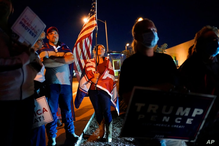 Supporters of President Donald Trump protest the Nevada vote in front of the Clark County Election Department, Wednesday, Nov…