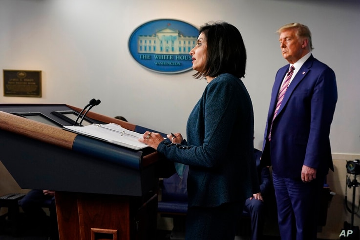 President Donald Trump listens as Administrator of the Centers for Medicare and Medicaid Services Seema Verma speaks during a…