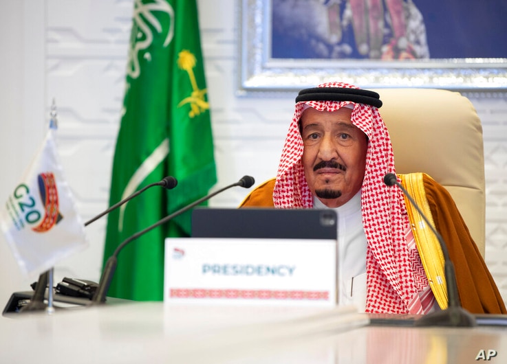 In this handout image provided by Saudi Royal Palace, Saudi King Salman gives his opening remarks at a virtual G20 summit…
