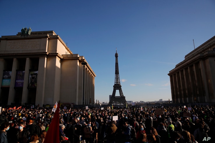 Demonstrators gather during a protest against bill on police images, in Paris, Saturday, Nov. 21, 2020. Thousands of people…
