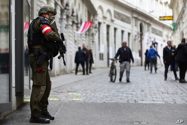 A military police officer guard at the crime scene near a synagogue in Vienna, Austria, Wednesday, Nov. 4, 2020. Several shots…