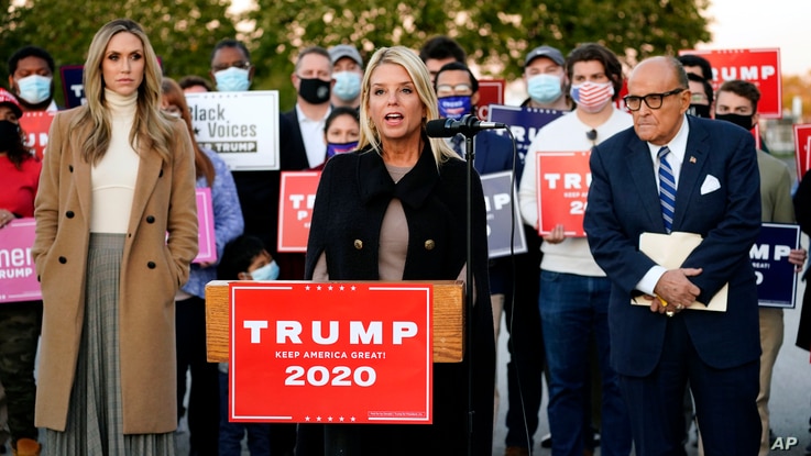 Former Florida Attorney General Pam Bondi, center, speaks during a news conference on legal challenges to vote counting in…