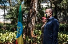 FILE - Prime Minister of Ethiopia Abiy Ahmed stands during an event honoring the national defense forces, in Addis Ababa, Nov. 17, 2020. 