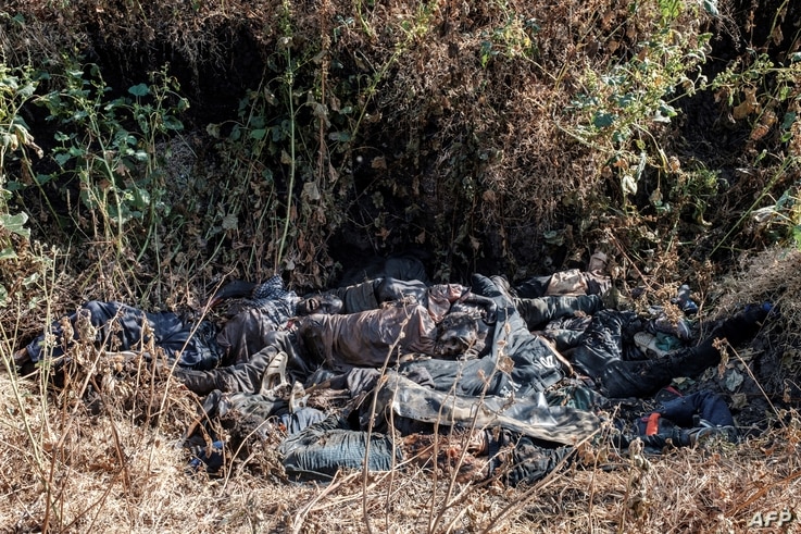 A general view of a ditch in the outskirts of Mai Kadra, Ethiopia, Nov. 21, 2020, filled with more than 20 bodies of victims that were allegedly killed in a massacre on Nov. 9, 2020.