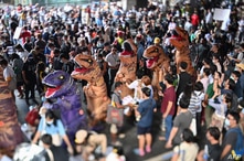 A photo taken with a tilt-shift lens shows protesters dressed in dinosaur costumes, which pro-democracy activists said represent the older generation of Thai politicians, during a 'Bad Student' rally in Bangkok, Thailand, Nov. 21, 2020.