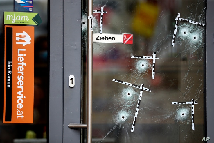 Bullet holes are marked on a door at the crime scene in Vienna, Austria, Nov. 4, 2020.