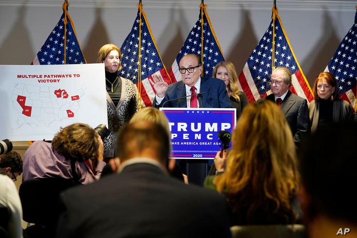 Former Mayor of New York Rudy Giuliani, a lawyer for President Donald Trump, speaks during a news conference at the Republican National Committee headquarters, in Washington, Nov. 19, 2020. 
