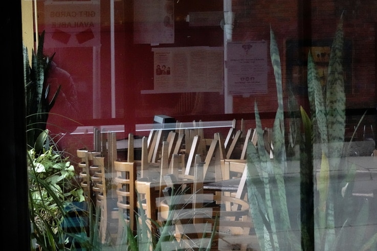 Stacked chairs are seen inside the closed Lao Laan Xang Restaurant as the coronavirus disease (COVID-19) outbreak continues in Madison