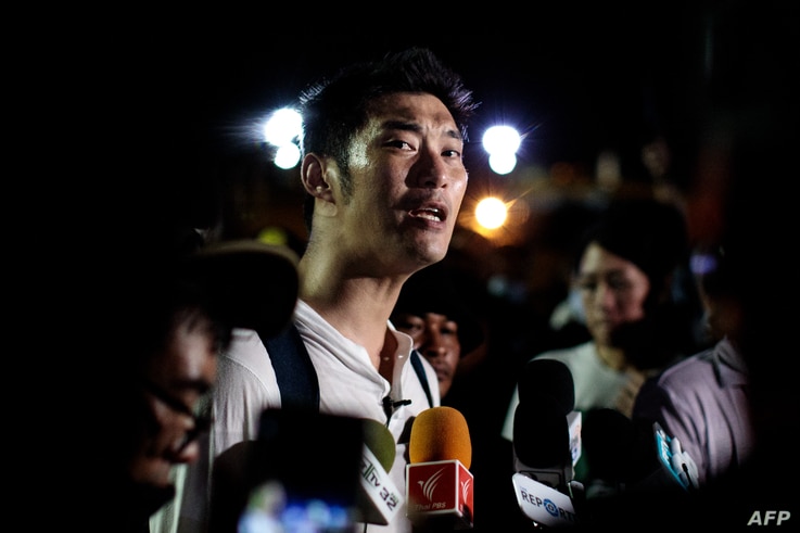 Thai prominent opposition figure Thanathorn Juangroongruangkit addresses the media as he attends a pro-democracy rally in…