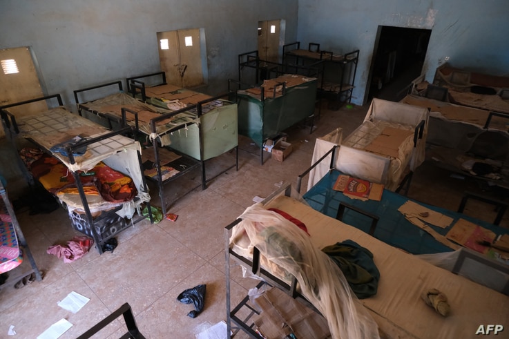An empty dormitory full of wares of schoolboys is seen after gunmen abducted students at the Government Science school in…