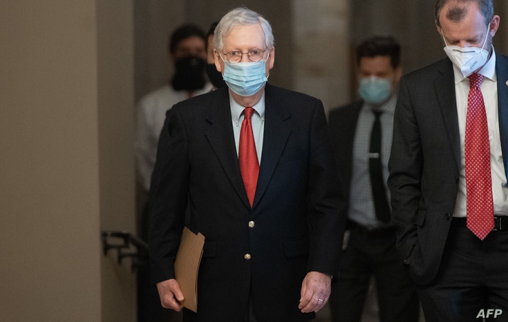 US Senate Majority Leader Mitch McConnell, Republican of Kentucky, walks to his office from the Senate Floor at the US Capitol…