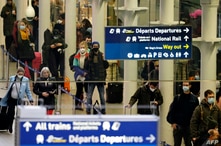 Passengers arrive at the Eurostar International Departures hall at St Pancras International station in London on December 23,…