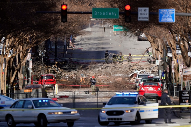 Investigators continue to examine the site of an explosion Sunday, Dec. 27, 2020, in downtown Nashville, Tenn. An explosion…