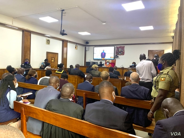 A court in process hears a bail application of human rights lawyer Nicholas Opio, on screen, in Kampala, Uganda, Dec. 30, 2020. (Halima Athumani/VOA)