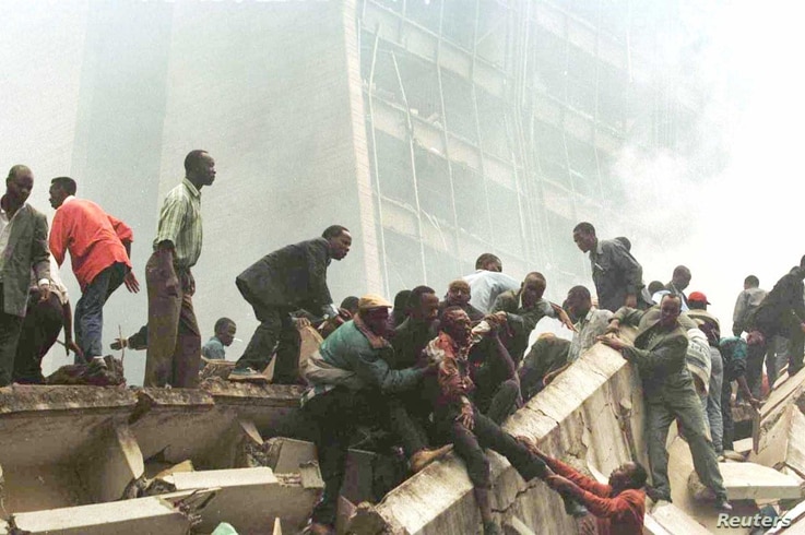 An injured man is removed from the wreckage after an explosion near the U.S. Embassy in Nairobi on August 7, 1998. A jury on…