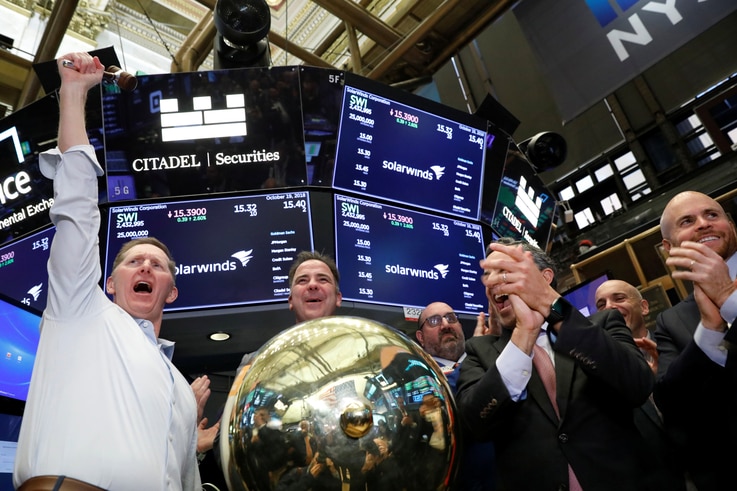SolarWinds Corp. CEO Kevin Thompson celebrates his company's IPO on the floor of the New York Stock Exchange (NYSE) in New York…