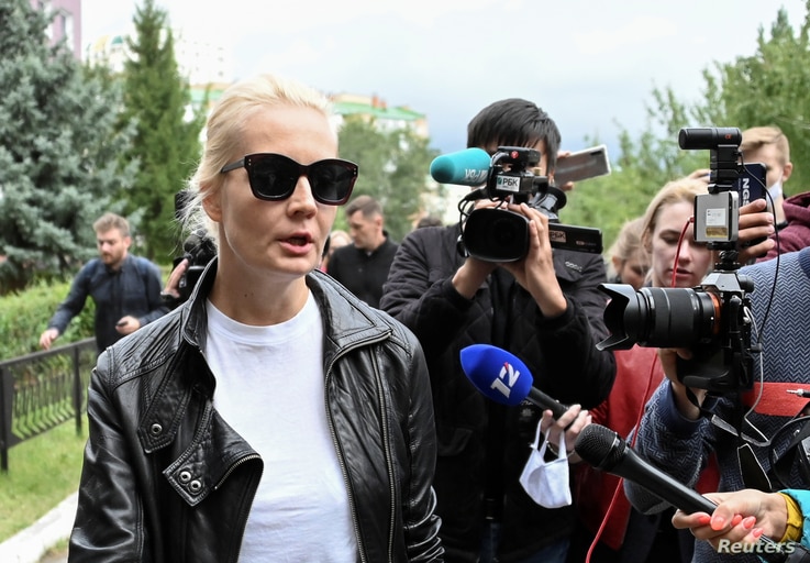 Yulia Navalnaya, wife of Russian opposition leader Alexei Navalny, speaks with the media outside a hospital, where Alexei receives medical treatment in Omsk, Russia, Aug. 21, 2020.