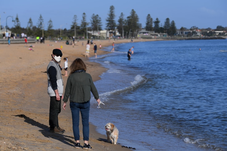People enjoy the sunshine, as Victoria state begins easing coronavirus disease (COVID-19) restrictions, at Elwood beach in Melbourne, Australia, Sept. 14, 2020.