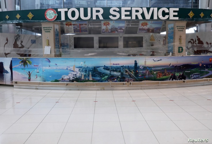 Closed tourist service counter is seen at the arrivals hall of Suvarnabhumi Airport during the coronavirus disease (COVID-19)…