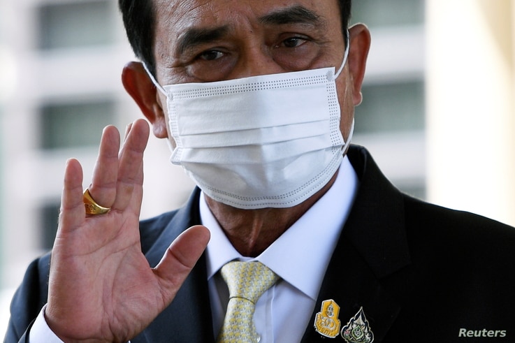 Thailand Prime Minister Prayuth Chan-ocha waves as he attends an agreement signing ceremony for purchase of AstraZeneca's potential COVID-19 vaccine at Government House, amid the spread of the coronavirus disease (COVID-19), in Bangkok, Nov. 27, 2020.