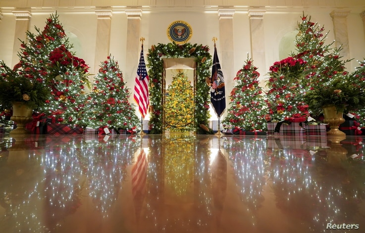 Holiday decor adorns the Cross Hall of the White House in Washington, Nov. 30, 2020.  