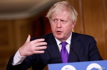 Britain's Prime Minister Boris Johnson speaks during a news conference on the ongoing situation with the coronavirus disease …