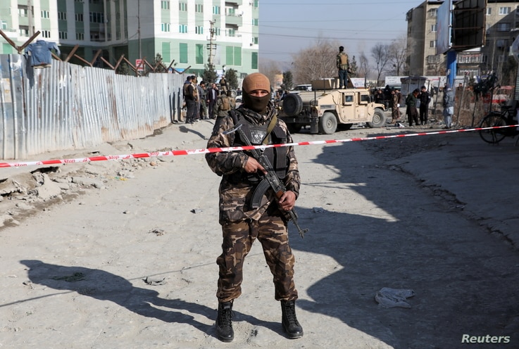 An Afghan security officer stands guard at the site of a bomb blast in Kabul, Afghanistan December 15, 2020. REUTERS/Omar…