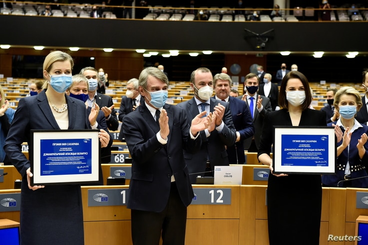 European Parliament President David Sassoli and others applaud and congratulate Belarus' opposition figures Veronika Tsepkalo …