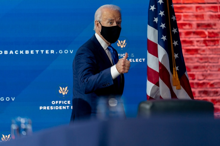 President-elect Joe Biden departs a news conference after introducing his nominees and appointees to economic policy posts at…